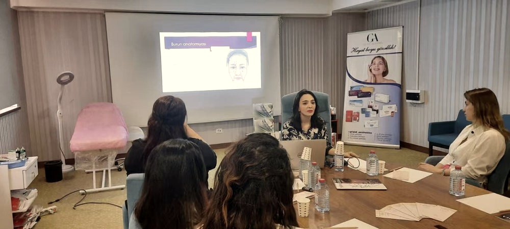 Pakiza Aghayeva leading a facial anatomy training session for practitioners