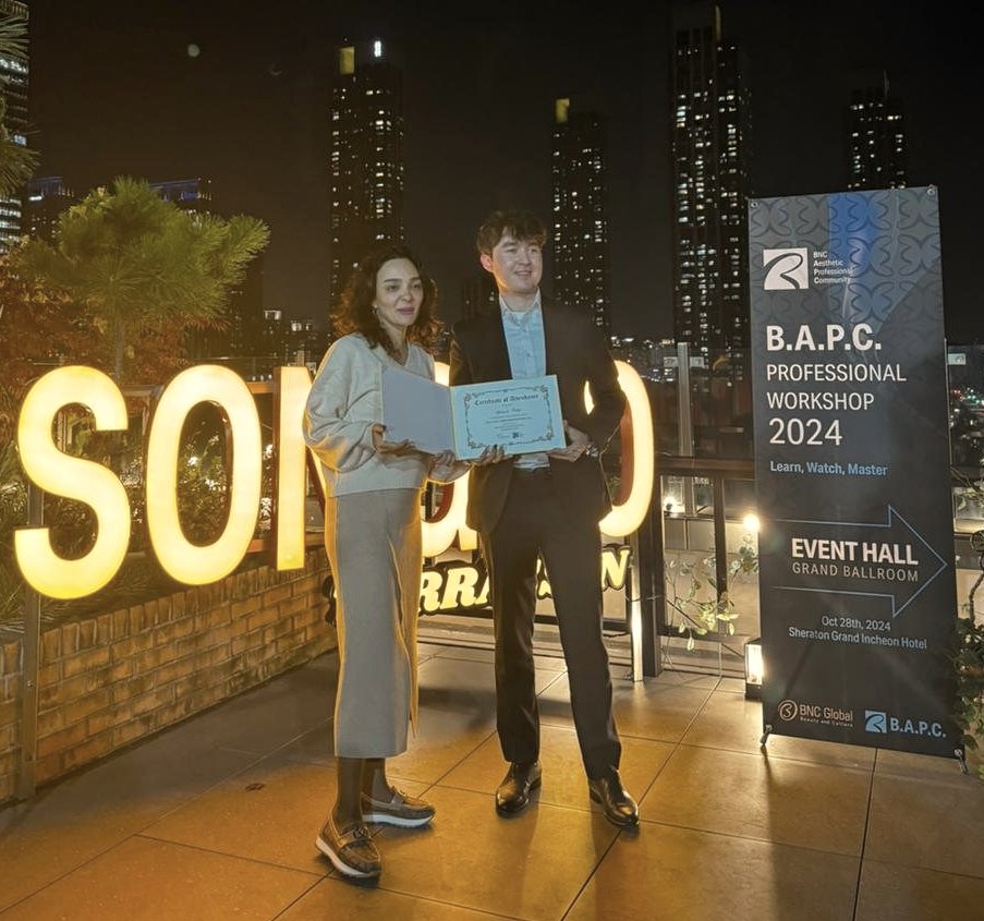 Pakiza Aghayeva receiving a certificate at the B.A.P.C. Professional Workshop in Incheon